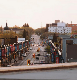 Timmins Care Urban street at dusk in Timmins with vehicles and street lights. Cochrane District Social Services Administration Board